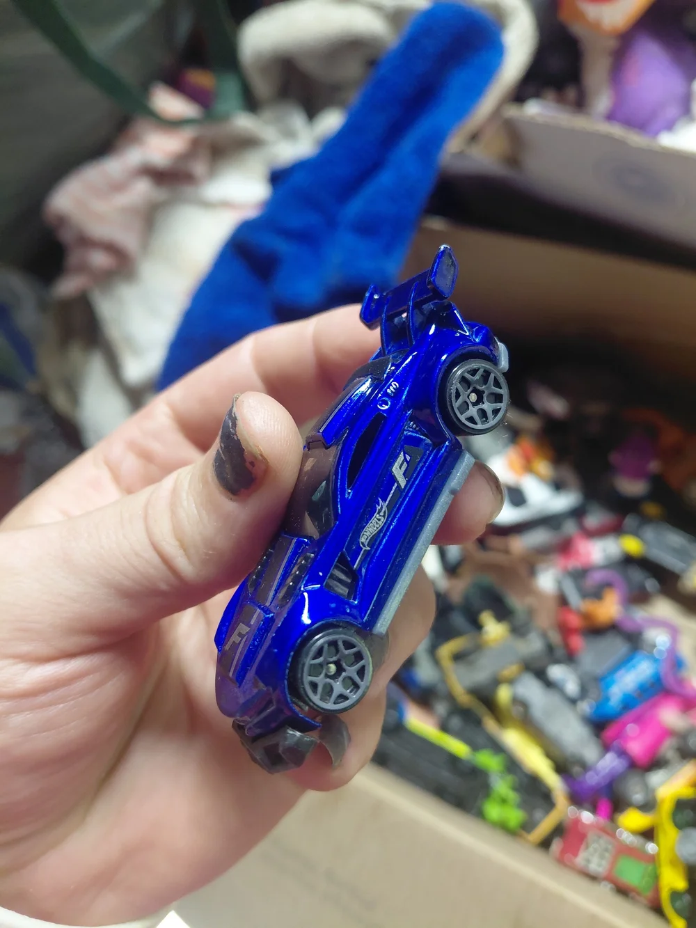 1:64 scale Hot Wheels Track Ripper in metallic blue